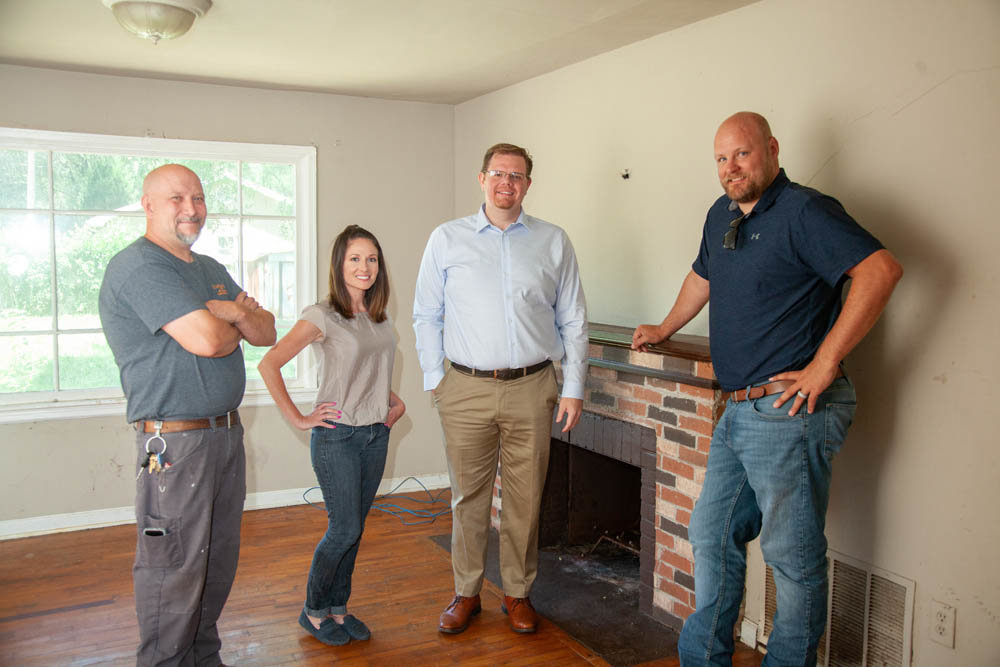 READY TO RENOVATE: From left, Bob Love, Jamie Thomas, Titus Williams and Justin Foos stand in one of the 417 Rentals homes that Prosperiti Partners is renovating.